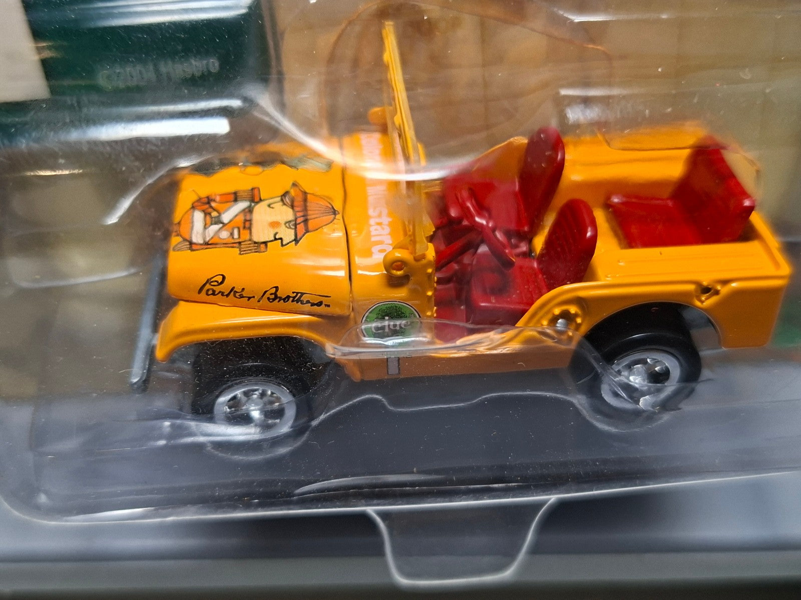 Johnny Lightning 2004 cluedo  Colonel mustard jeep CJ-5   (NG66)