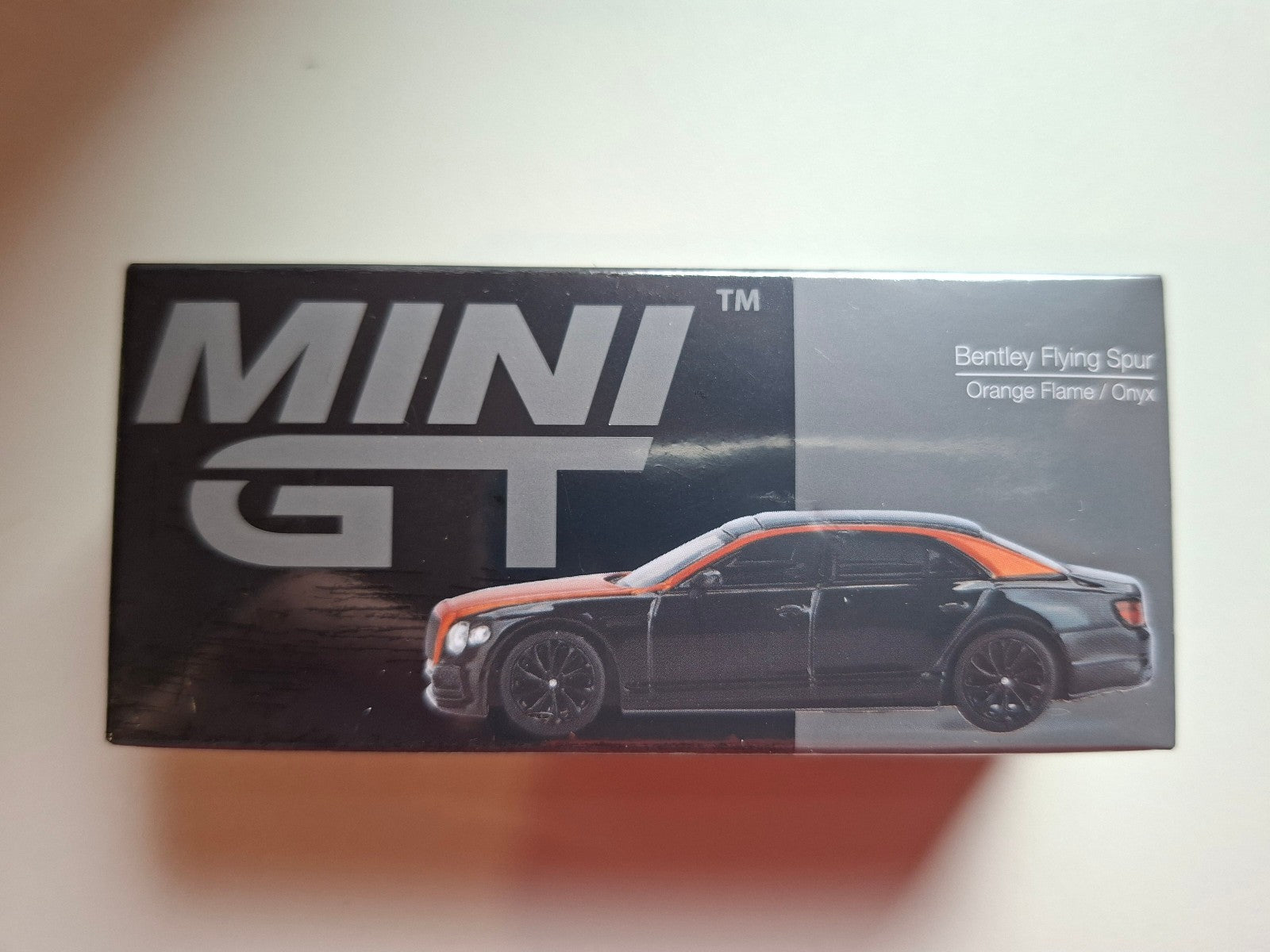 Mini GT 2024 Bentley Flying Spur, orange flame-onyx N°991 (NP11)