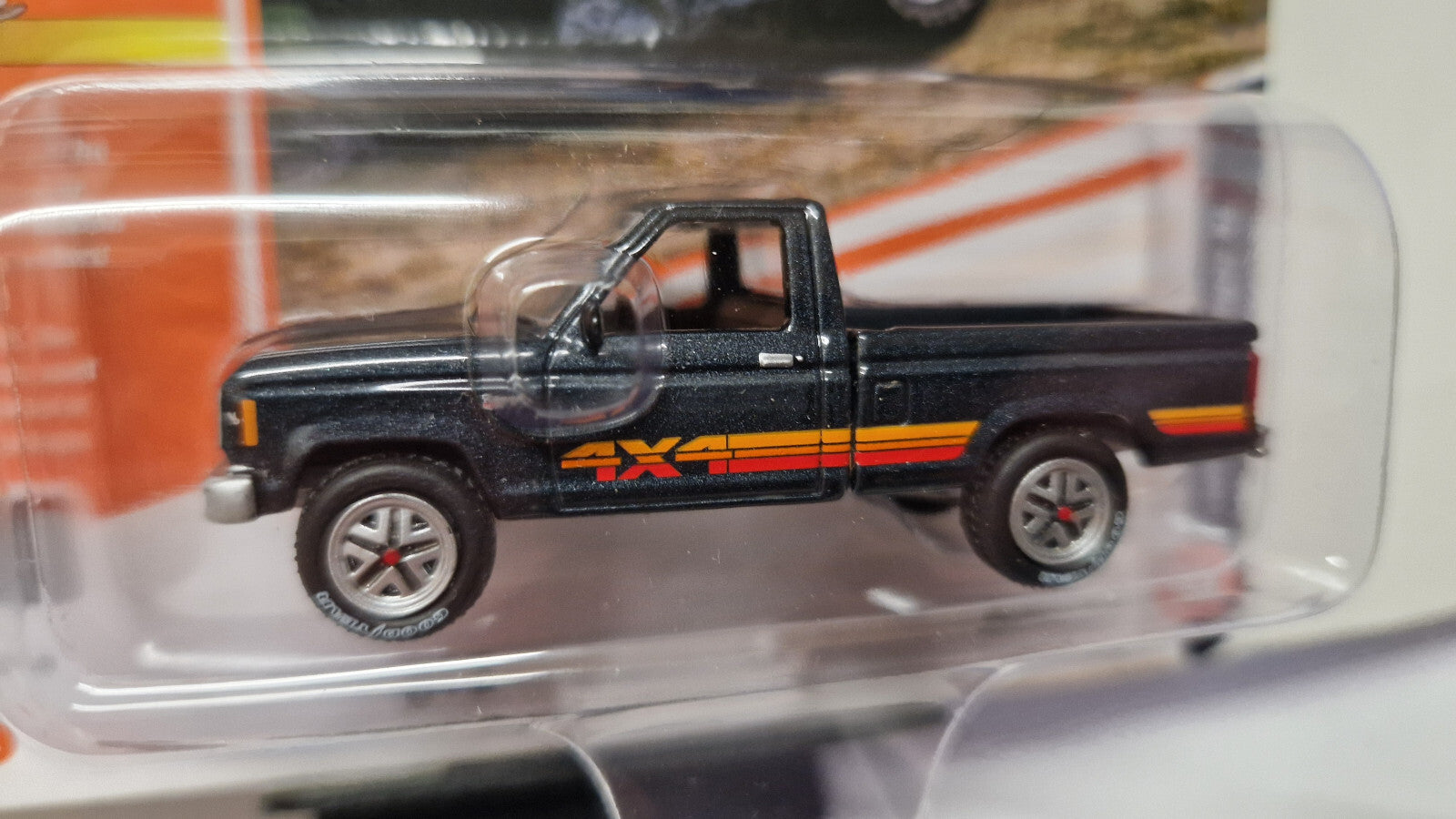 Johnny Lightning Classic gold  1985 Ford Ranger in Dark Charcoal Poly   (NG16)